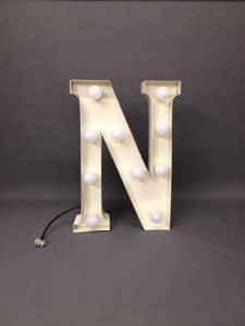 white marquee letter n